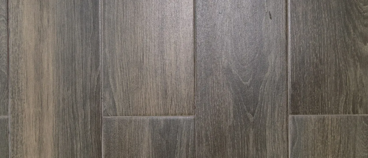 Gray wood-look floor planks laid in a staggered pattern