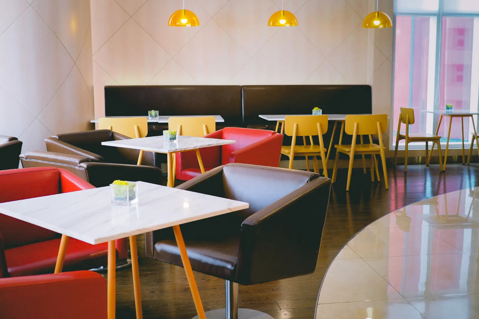 Cafe interior with tables, chairs and pendant lights