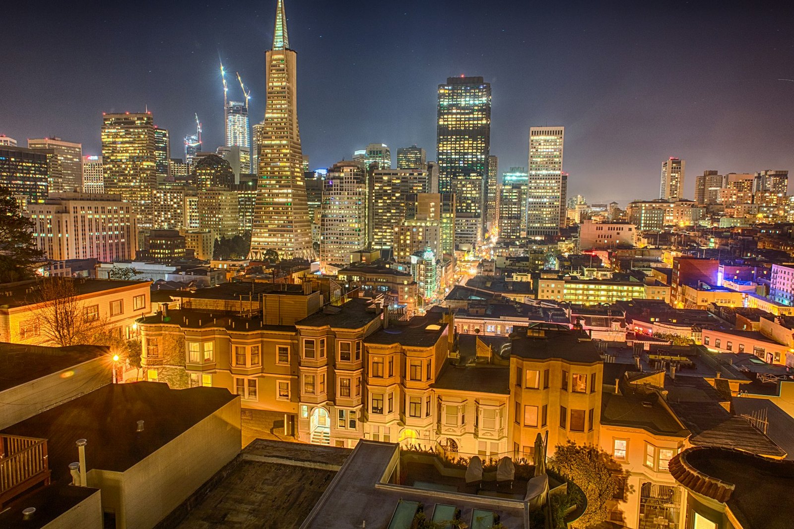 Downtown skyline at night over the rooftops of North Beach, San Francisco